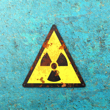 Warning sign nuclear site, sign hanging on a wall. Indication of the presence of a radioactive area, 3d render. Nuclear weapons. Dangerous siteの写真素材