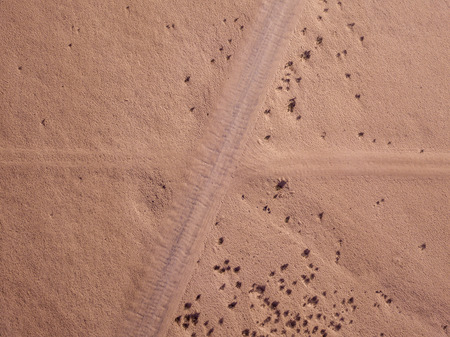 Aerial view of a desert landscape on the island of Lanzarote, Canary Islands, Spain. Road that...