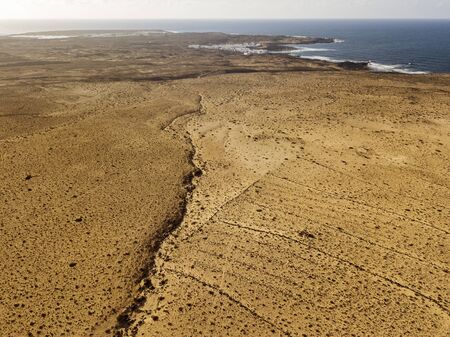 Aerial view of a desert landscape on the island of Lanzarote, Canary Islands, Spain. Desert...