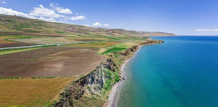 Aerial view of the lake. The largest lake in Turkey. Fields and cliffs overlooking the crystal clear waters. Roads along the lakeの写真素材