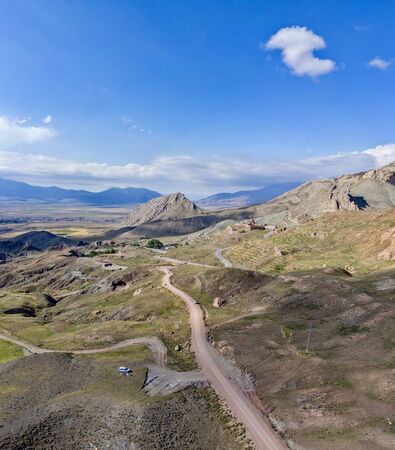 Aerial view of dirt roads on the plateau around Mount Ararat, winding roads between rocky peaks and hills. Heights around the palace of Ishak Pasha. Eastern Turkeyの写真素材