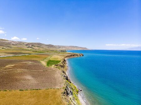 Aerial view of the lake. The largest lake in Turkey. Fields and cliffs overlooking the crystal clear waters. Roads along the lakeの写真素材