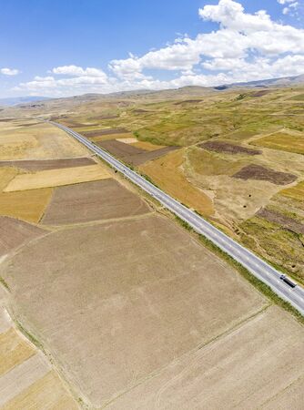 Aerial view of fields in the lake. The largest lake in Turkey, it lies in the middle of the country in the provinces of Van and Bitlis. Fields and cliffs. Roads along the lakeの写真素材