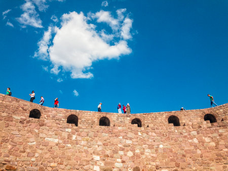 View of the walls of Ankara Castle (Kalesi), people walking on the walls. Sunny day with clouds. 06/27/2019. Capital of Turkey. Historical monumentのeditorial素材