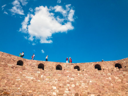 View of the walls of Ankara Castle (Kalesi), people walking on the walls. Sunny day with clouds. 06/27/2019. Capital of Turkey. Historical monumentのeditorial素材