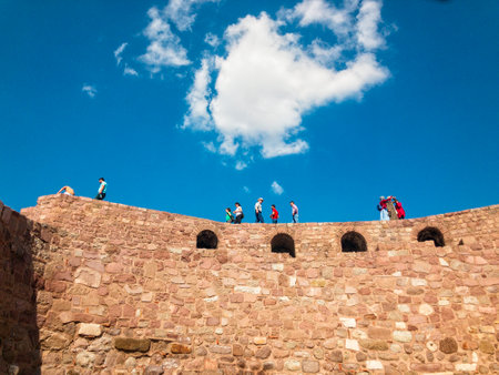 View of the walls of Ankara Castle (Kalesi), people walking on the walls. Sunny day with clouds. 06/27/2019. Capital of Turkey. Historical monumentのeditorial素材