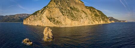 Aerial view of Buljarica headland, steep cliff on the coast lapped by crystal clear waters of the Adriatic sea. Petrovac, coastal town in Budva municipality. montenegroの写真素材