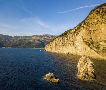 Aerial view of Buljarica headland, steep cliff on the coast lapped by crystal clear waters of the Adriatic sea. Petrovac, coastal town in Budva municipality. montenegroの写真素材