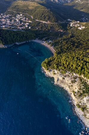 Aerial view of Petrovac and Lucice beach, one of the most beautiful sandy beaches. Umbrellas and bathers at sunset. montenegroの写真素材