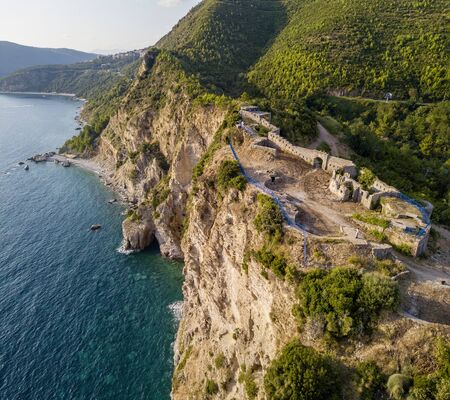 Aerial view of Mogren Fortress, Tvrdava Mogren, it is located on a promontory Mogren between the beaches Mogren and Jaz just a kilometer from the town of Budva. Montenegro. Jagged coastの写真素材