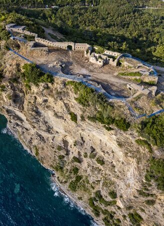 Aerial view of Mogren Fortress, Tvrdava Mogren, it is located on a promontory Mogren between the beaches Mogren and Jaz just a kilometer from the town of Budva. Montenegro. Jagged coastの写真素材