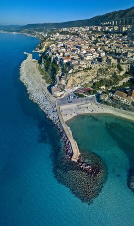 Aerial view of Pizzo Calabro, pier, castle, Calabria, tourism Italy. Panoramic view of the small town of Pizzo Calabro by the sea. Houses on the rock. On the cliff stands the Aragonese castle. Seafrontの写真素材