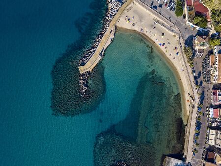 Aerial view of the Marina beach, Pizzo Calabro. The pier and the beach with umbrellas and bathers. Coast of Calabria. italyの写真素材