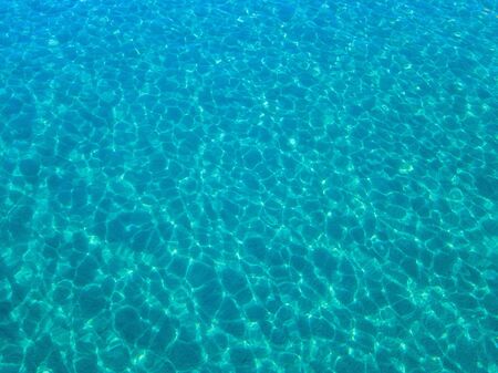 Aerial view of a sandy beach, reflections of the sun. Texture and background. Poolの写真素材