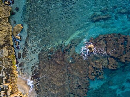 Aerial view of seabed seen from above, transparent water