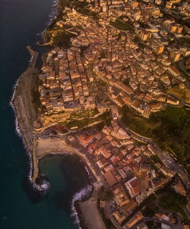 Aerial view of Pizzo Calabro, pier, castle, Calabria, tourism Italy. Pizzo Calabro by the sea. Houses on the rock. On the cliff stands the Aragonese castle. Seafront at sunsetの写真素材