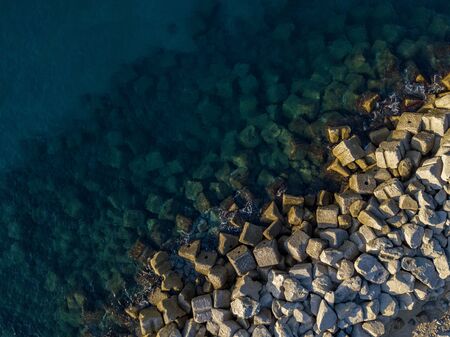 Aerial view of rocks on the sea. Overview of seabed seen from above, transparent water.の写真素材