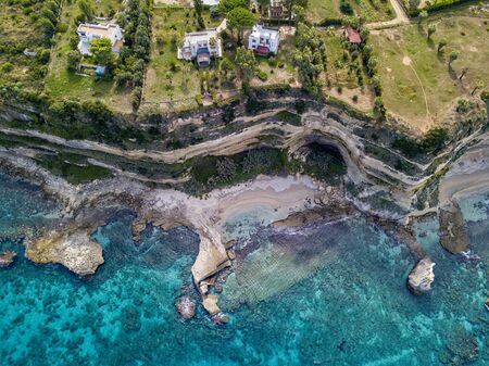 Aerial view of the Calabrian coast, villas and resorts on the cliff. Transparent sea and wild coast. Locality of Riaci near Tropea, Calabria. Italyの写真素材