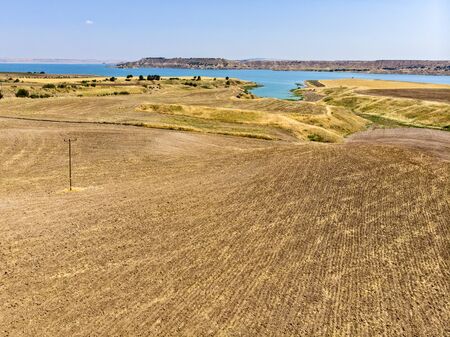 Aerial view of rural areas south of Lokman in the province of Adiyaman, Turkey. Inlets on the Euphrates river formed by the Ataturk dam. Desert landsの写真素材