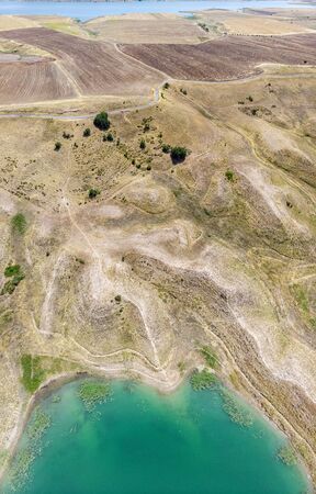 Aerial view of rural areas south of Lokman in the province of Adiyaman, Turkey. Inlets on the Euphrates river formed by the Ataturk dam. Desert landsの写真素材