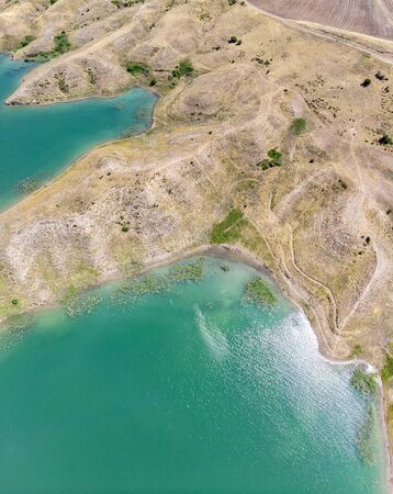 Aerial view of rural areas south of Lokman in the province of Adiyaman, Turkey. Inlets on the Euphrates river formed by the Ataturk dam. Desert landsの写真素材