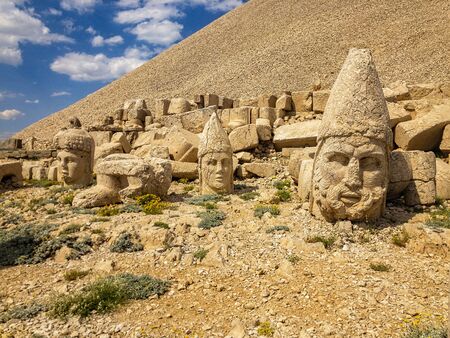 Panoramic view of the statues near the peak of Nemrut Dagi. King Antiochus I Mount of Nemrut at tomb-sanctuary flanked by huge statues. turkeyの写真素材