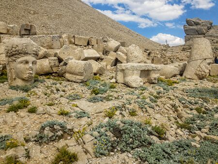 Panoramic view of the statues near the peak of Nemrut Dagi. King Antiochus I Mount of Nemrut at tomb-sanctuary flanked by huge statues. turkeyの写真素材