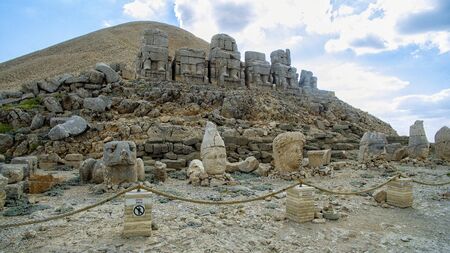 Panoramic view of the statues near the peak of Nemrut Dagi. King Antiochus I Mount of Nemrut at tomb-sanctuary flanked by huge statues. turkeyの写真素材