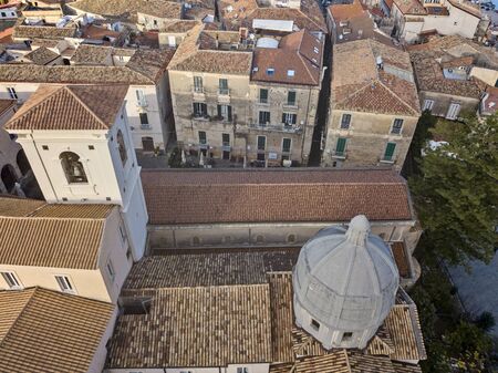 Aerial view of the cathedral, Cathedral of Maria Santissima of Romania. Roofs and houses of the city of Tropea, Calabria. Italy.の写真素材