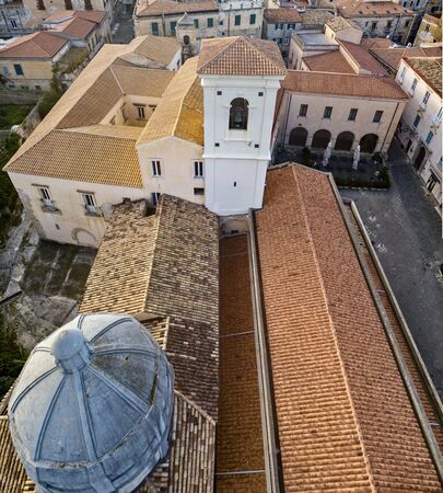 Aerial view of the cathedral, Cathedral of Maria Santissima of Romania. Roofs and houses of the city of Tropea, Calabria. Italy.の写真素材
