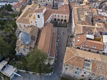 Aerial view of the cathedral, Cathedral of Maria Santissima of Romania. Roofs and houses of the city of Tropea, Calabria. Italy.の写真素材
