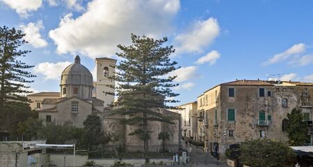 Aerial view of the cathedral, Cathedral of Maria Santissima of Romania. Roofs and houses of the city of Tropea, Calabria. Italy.の写真素材