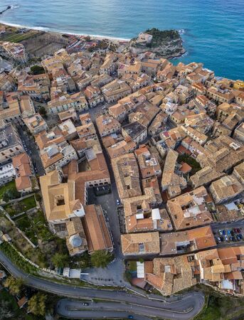 Aerial view of Tropea, house on the rock and Sanctuary of Santa Maria dell'Isola, Calabria. Italy. Tourist destinations of the most famous in Southern Italy, seaside resort located on a cliff in the gulf of Sant'Eufemia. Rooftopsの写真素材