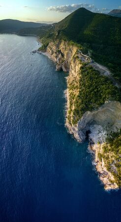 Aerial view of Mogren Fortress, Tvrdava Mogren, it is located on a promontory Mogren between the beaches Mogren and Jaz just a kilometer from the town of Budva. Montenegro. Jagged coastの写真素材