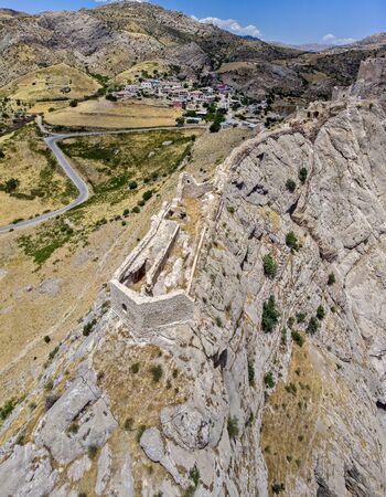 Aerial view of Kahta Castle, Kalesi. The Yeni Kale Fortress in Eski Kahta is perched atop a hill with a steep slope. Walls of the manor surround the entire hill. Very close to Mount Nemrut. Anatolia. turkeyの写真素材