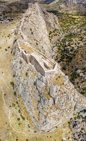 Aerial view of Kahta Castle, Kalesi. The Yeni Kale Fortress in Eski Kahta is perched atop a hill with a steep slope. Walls of the manor surround the entire hill. Very close to Mount Nemrut. Anatolia. turkeyの写真素材