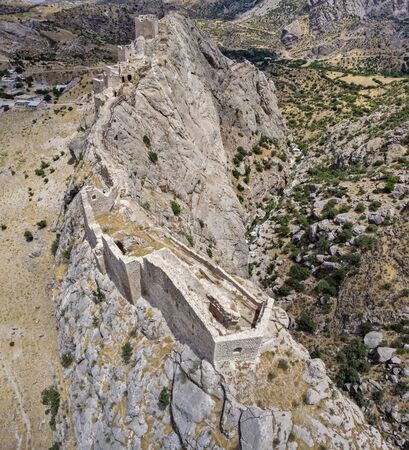 Aerial view of Kahta Castle, Kalesi. The Yeni Kale Fortress in Eski Kahta is perched atop a hill with a steep slope. Walls of the manor surround the entire hill. Very close to Mount Nemrut. Anatolia. turkeyの写真素材
