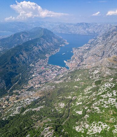Aerial view of the Bay of Kotor, Boka. Old city of Kotor and the fortifications. The top of the mountain of St. John and the fortress. Tourism and cruise ships. The bay is the largest fjord in the Mediterranean. montenegroの写真素材
