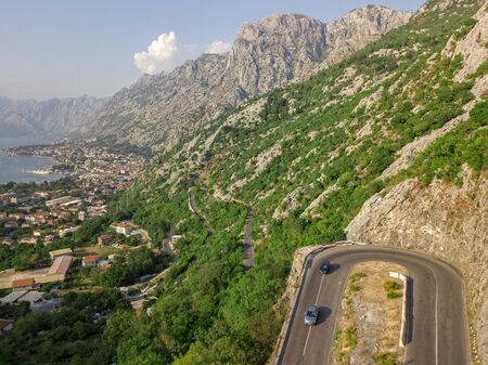Aerial view of the Bay of Kotor, Boka. Old city of Kotor and the fortifications. The top of the mountain of St. John and the fortress. Tourism and cruise ships. The bay is the largest fjord in the Mediterranean. montenegroの写真素材