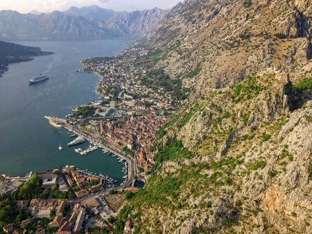 Aerial view of the Bay of Kotor, Boka. Old city of Kotor and the fortifications. The top of the mountain of St. John and the fortress. Tourism and cruise ships. The bay is the largest fjord in the Mediterranean. montenegroの写真素材
