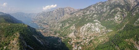 Aerial view of the Bay of Kotor, Boka. Old city of Kotor, fortifications. Mountain of St. John and the fortress. Tourism and cruise ships. The bay is the largest fjord in the Mediterranean. montenegroの写真素材