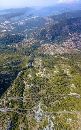 Aerial view of one of the most winding roads in the world, near Kotor, Montenegro. Set in a breathtaking natural landscape.の写真素材