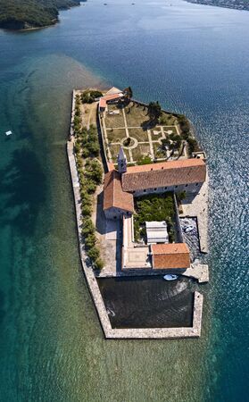 Aerial view of the island of Notre Dame de la Misï¿½ricorde, monastery in the Bay of Kotor near the island of Sveti Marko, Montenegro. Ostrvo Gospa od Milosrda.の写真素材