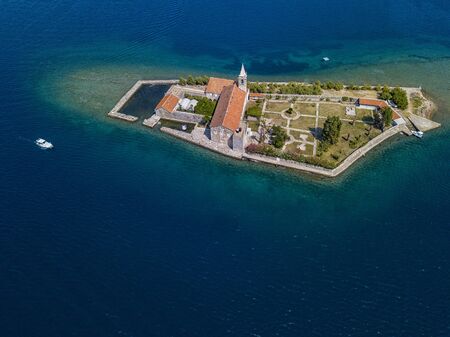 Aerial view of the island of Notre Dame de la Misï¿½ricorde, monastery in the Bay of Kotor near the island of Sveti Marko, Montenegro. Ostrvo Gospa od Milosrda.の写真素材