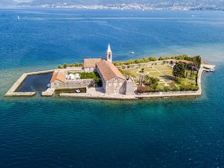 Aerial view of the island of Notre Dame de la Misï¿½ricorde, monastery in the Bay of Kotor near the island of Sveti Marko, Montenegro. Ostrvo Gospa od Milosrda.の写真素材