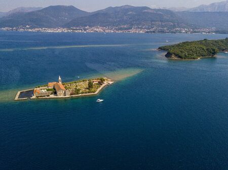Aerial view of the island of Notre Dame de la Misï¿½ricorde, monastery in the Bay of Kotor near the island of Sveti Marko, Montenegro. Ostrvo Gospa od Milosrda.の写真素材