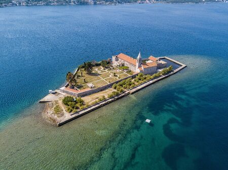 Aerial view of the island of Notre Dame de la Misï¿½ricorde, monastery in the Bay of Kotor near the island of Sveti Marko, Montenegro. Ostrvo Gospa od Milosrda.の写真素材