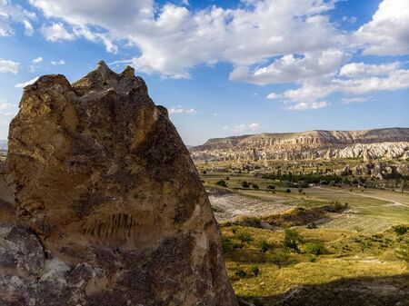 Aerial view of Goreme National Park, Tarihi Milli Parki, Turkey. The typical rock formations of Cappadocia with fairy chimneys and desert landscape. Travel destinations, holidays and adventureの写真素材