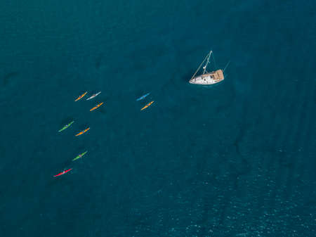 Aerial view of canoes sailing near the rugged coastlines and beaches of Lanzarote, Spain, Canaries. Explore the island. Bathers on the beach and in the Atlantic Ocean. Papagayoの写真素材