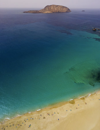 Aerial view of the beach Playa de Las Conchas in the north of La Graciosa, the main archipelago island Chinijo, a mile northwest of Lanzarote. Canary island. Spain. Ocean view and sand beachの写真素材
